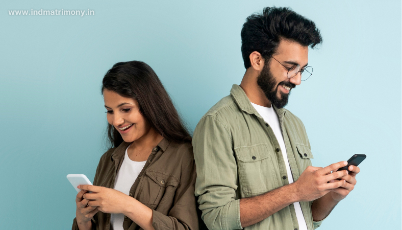 Young couple using phones on a matrimony platform, reflecting the question is matrimony safe in 2025.