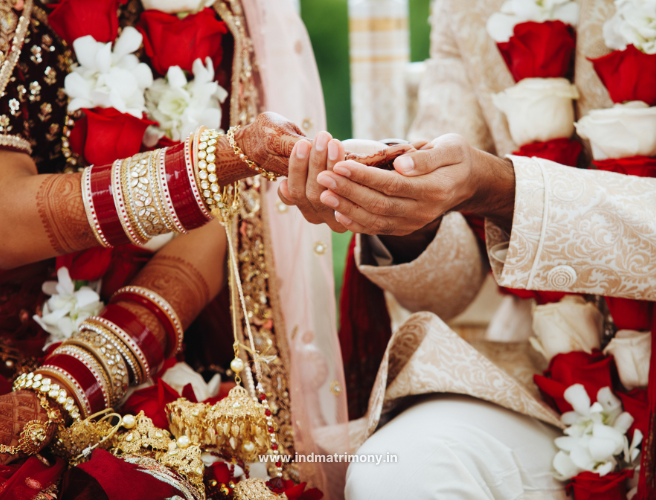Close-up of Indian bride and groom holding hands during wedding ritual symbolizing Signs You Found the Right Partner