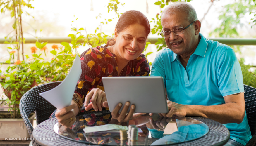 Smiling couple using a tablet to explore online matchmaking services on IND Matrimony