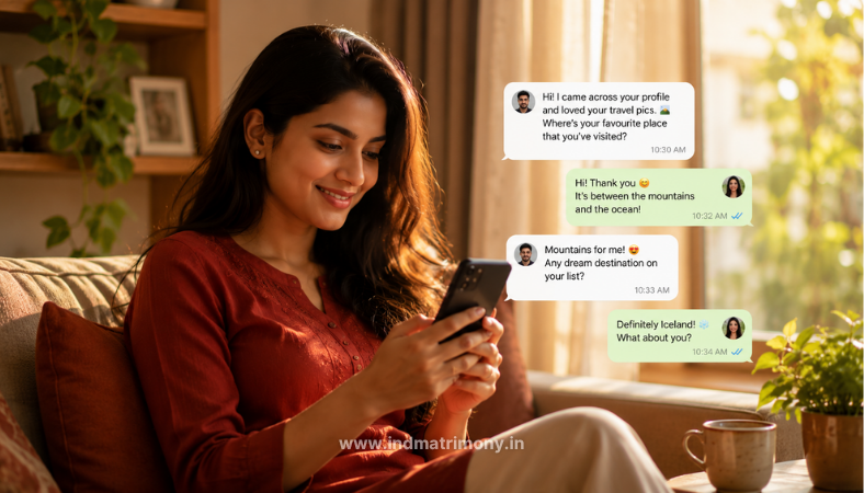 how to start conversation on matrimonial site — young Indian woman smiling while chatting on a matrimony app in a warm, cozy living room